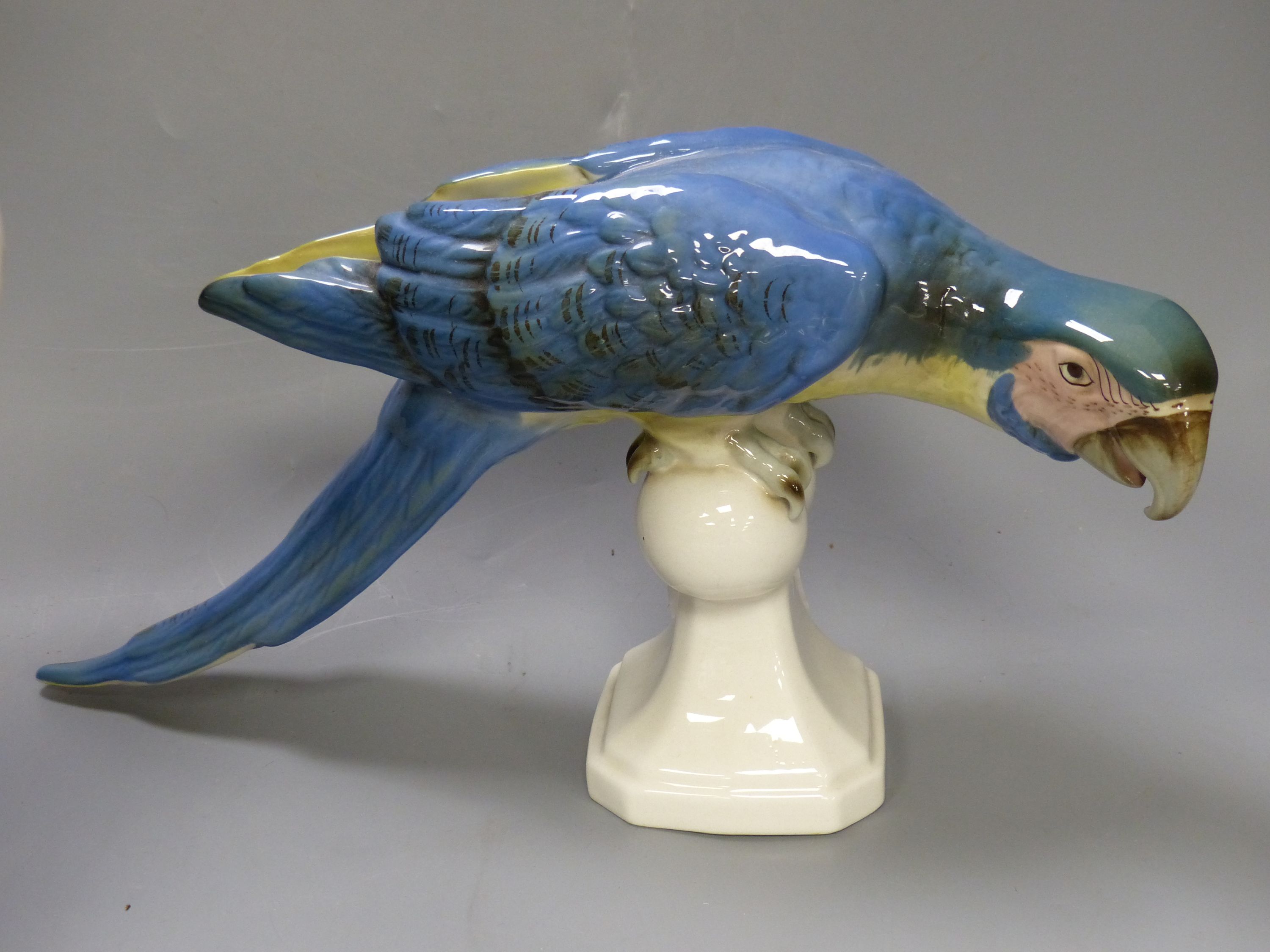 A Royal Dux ceramic parrot and cockatoo, tallest 40cm